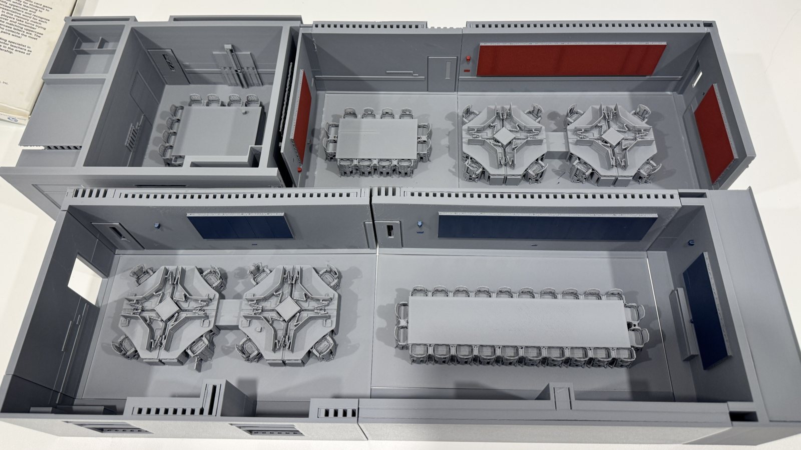 Two proposed layouts of a command centre, 3D-printed side by side for comparison