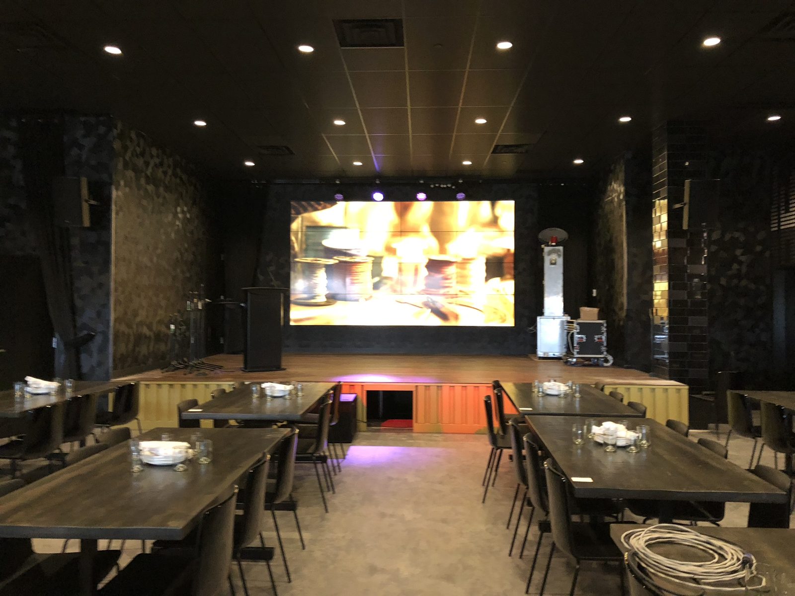 Live venue stage with LED screen and loudspeakers